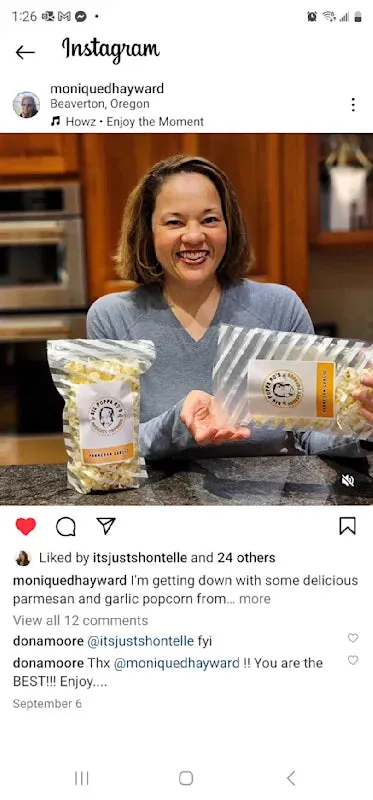 Instagram screenshot from moniquedhayward holding Parmesan Garlic popcorn, with her caption about enjoying the popcorn and Don’s thank-you reply.