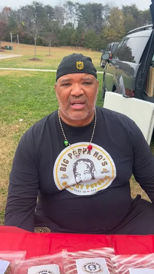 Don at a community pop-up wearing a Big Poppa Mo’s shirt.