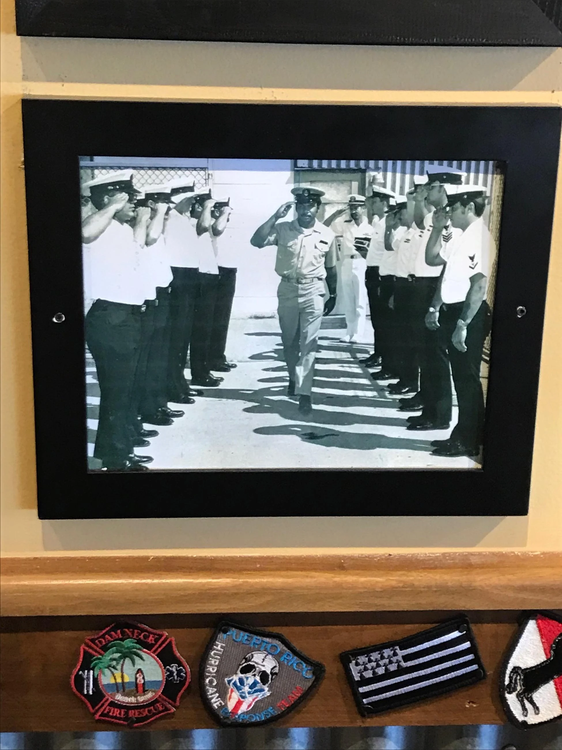 An archival photo of Simon Moore in uniform at a service ceremony